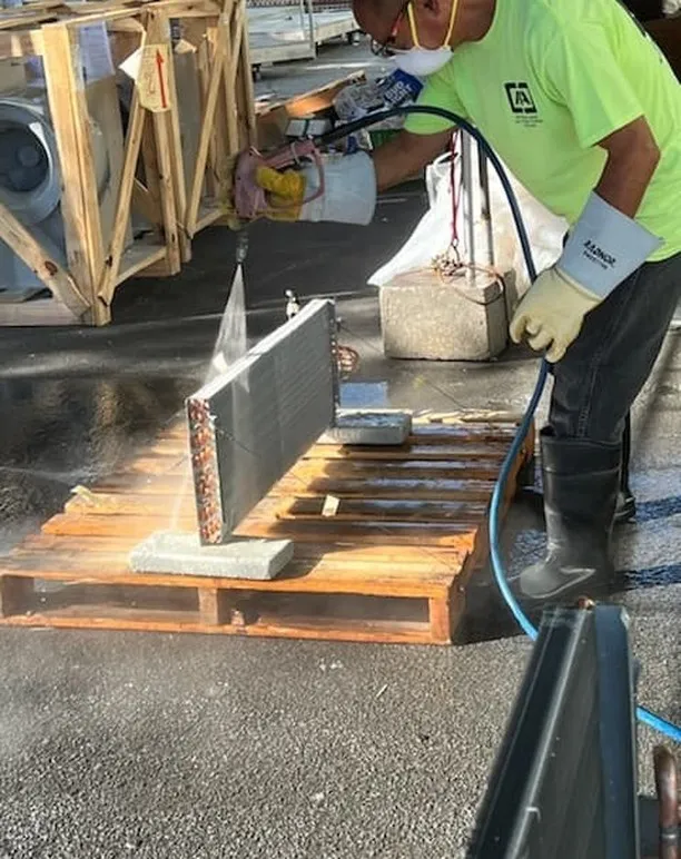 AC unit during additional prep work before coating.